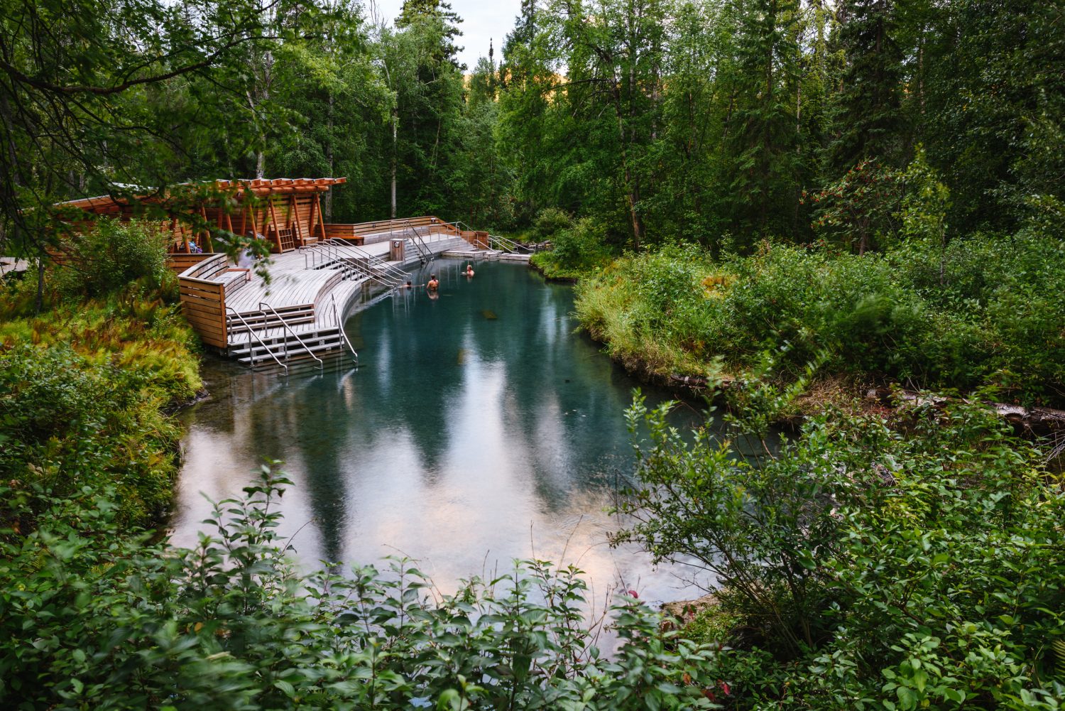 A couple people in the Liard River Hot Springs